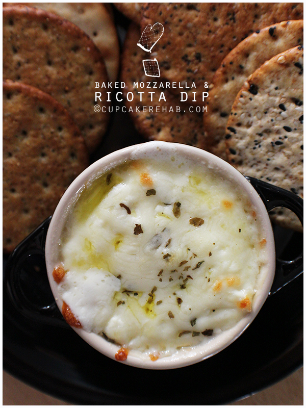 Baked ricotta dip with mozzarella, garlic, olive oil & basil. Goes great with Milton's Craft Bakers gourmet crackers!