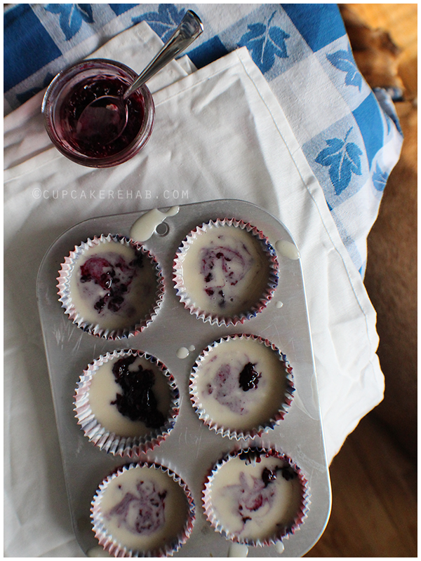 Triple berry vegan cupcakes with berry cream cheese frosting.