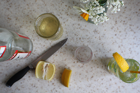 An easy cocktail made with three ingredients: lime simple syrup, seltzer, and vodka.