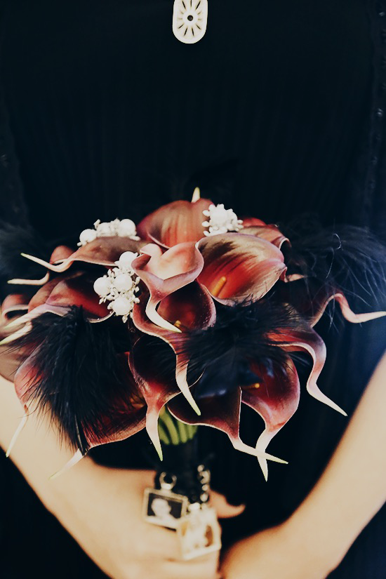 Red/plum Calla Lily bouquet with black feathers  and jewels by LilyOfAngeles on Etsy | A New York City Hall wedding #bridesinblack #offbeatbrides #nycbrides #offbeatbouquetideas #memorycharms