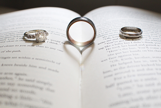 Our rings making a heart (on an F. Scott Fitzgerald book) | groom's wedding band by WedgewoodRings on Etsy | A New York City Hall wedding
