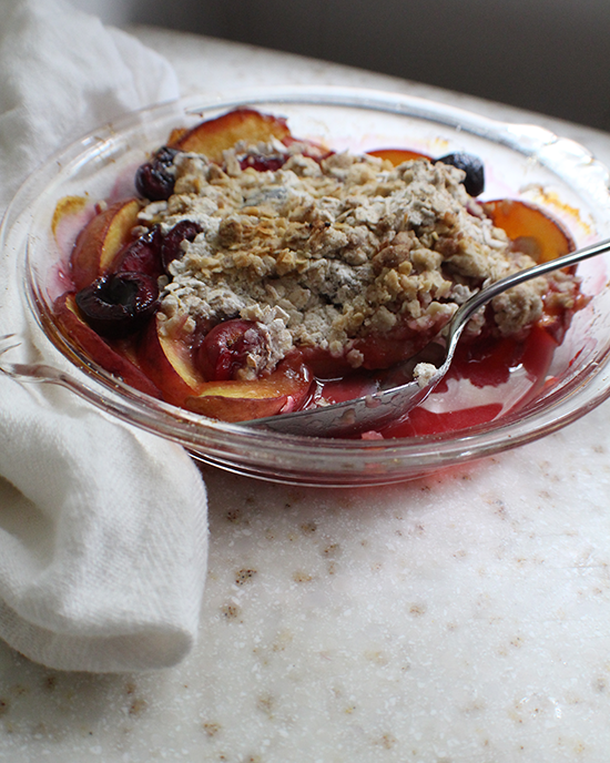 Peaches, plums and cherries in a breakfast crisp.