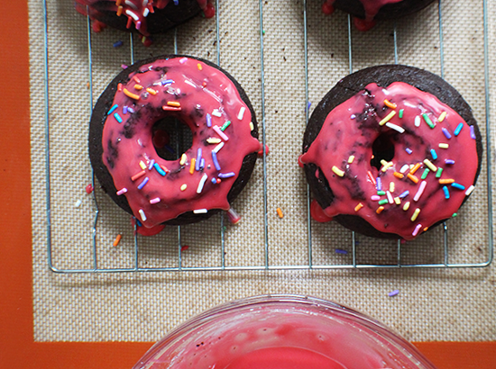 Pink-iced chocolate baked donuts.