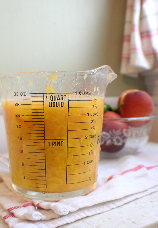 Four cups of mashed peaches for peach + pepper jam.